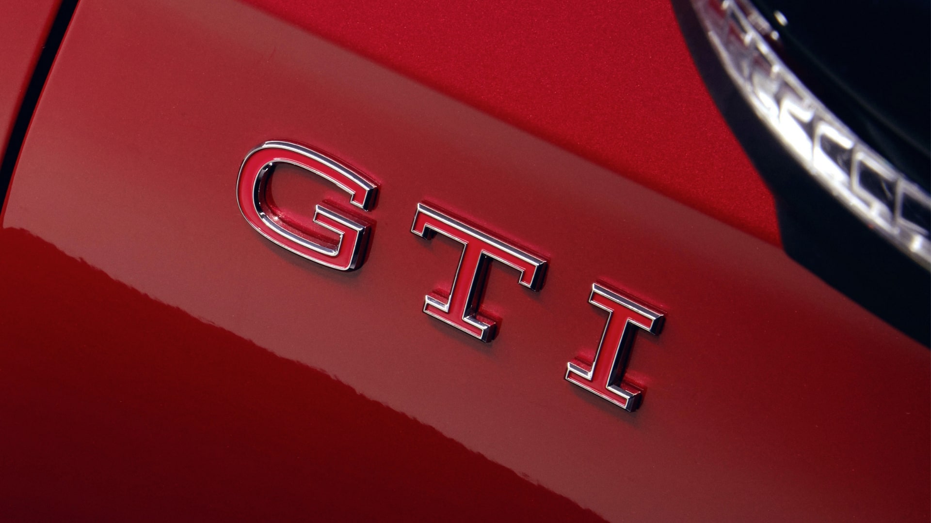 Close-up of a Volkswagen Golf GTI wheel and front fascia.