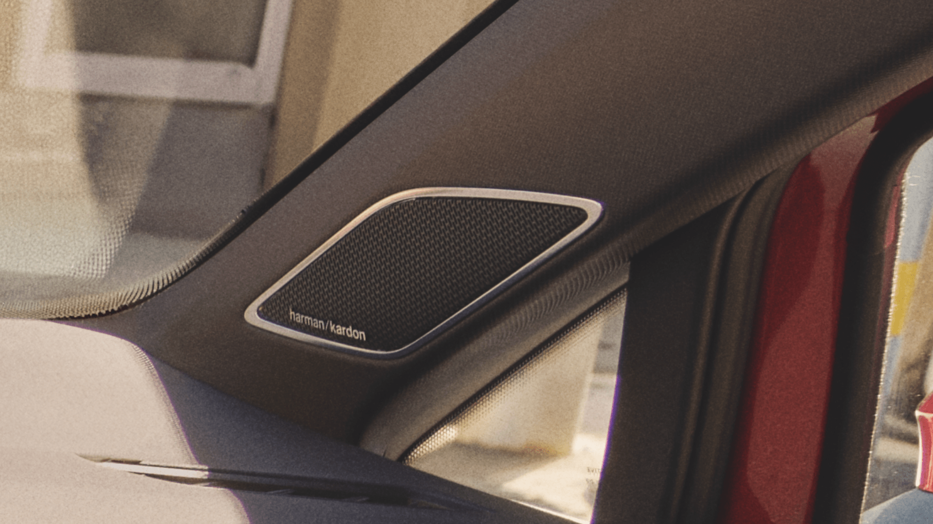 A close-up photo of the Harman / Kardon® audio system located in the 2025 Volkswagen GTI
