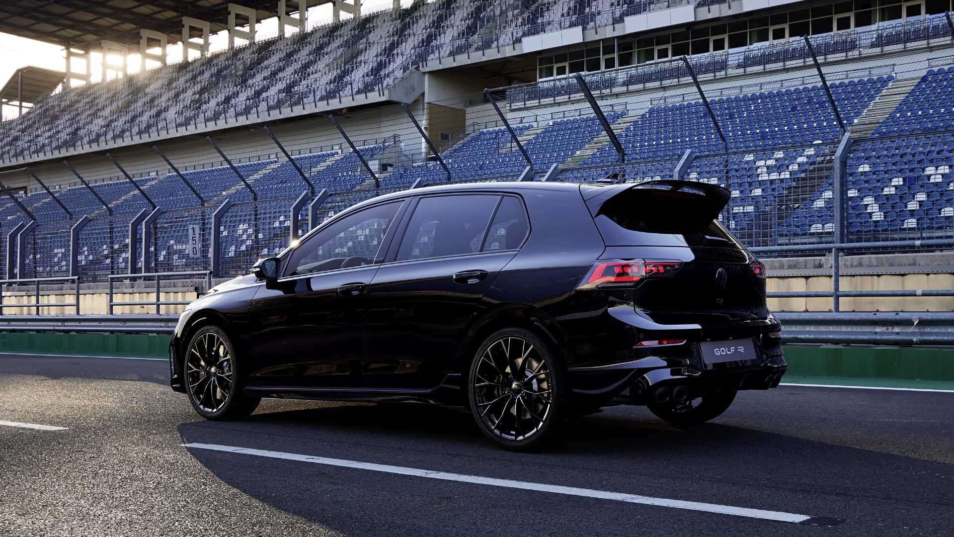 Volkswagen Golf R featuring the available Akrapovič titanium exhaust, shown on a race track.