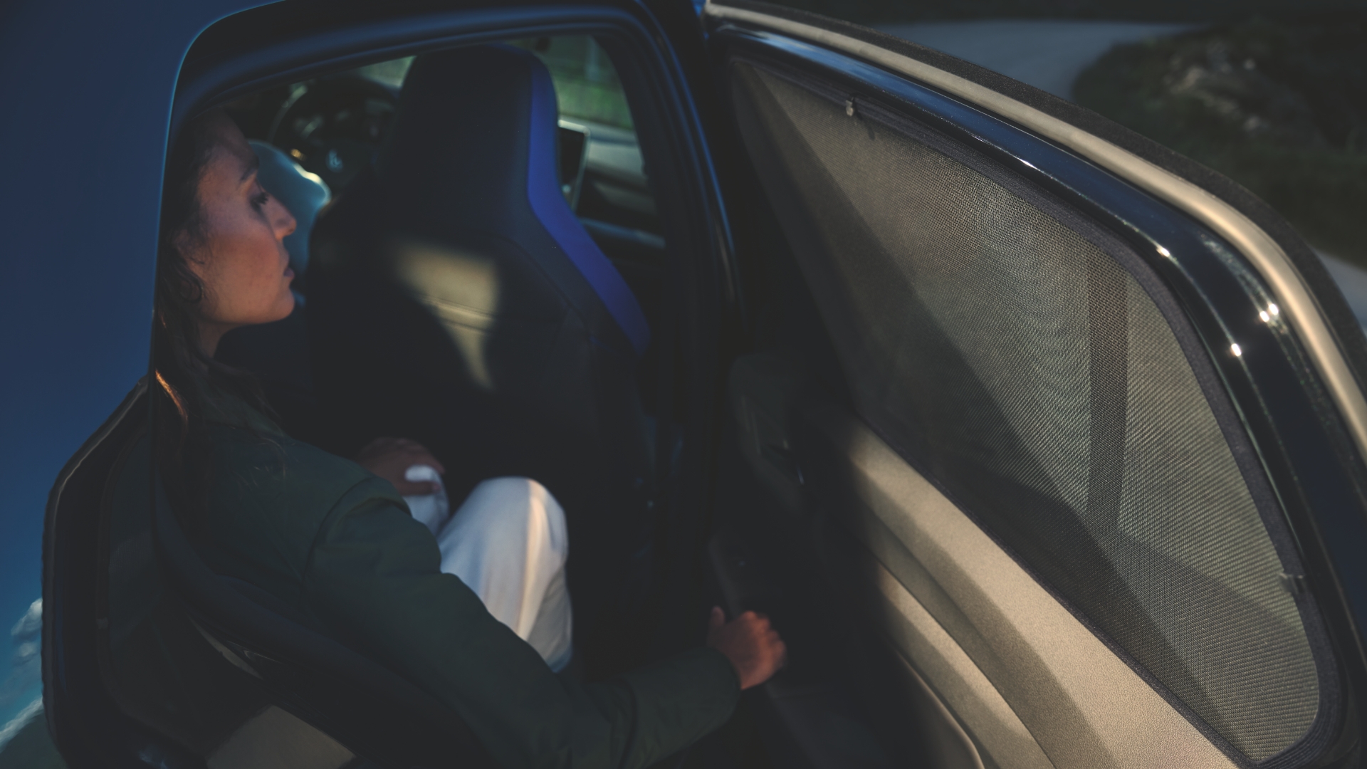 A woman sitting in a Volkswagen Golf R seat.
