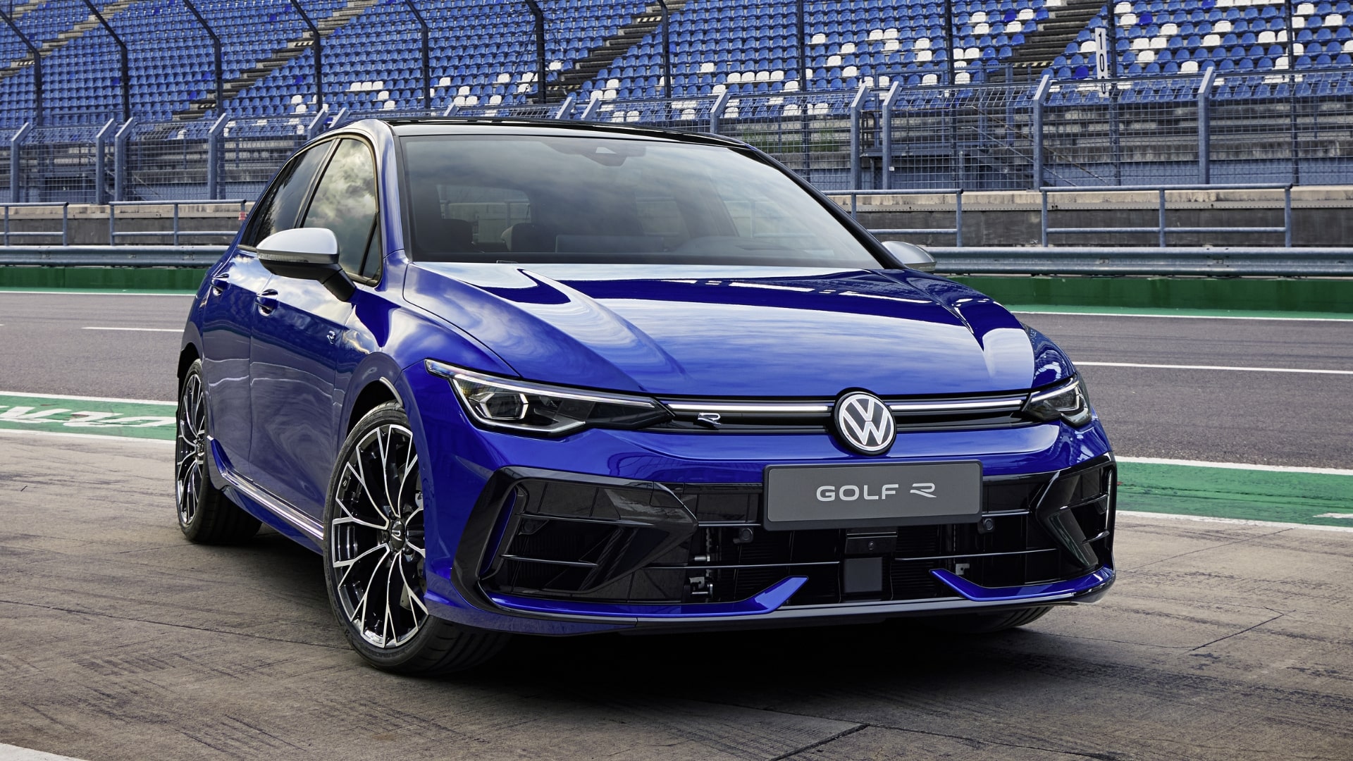 Blue Volkswagen Golf R on a racetrack