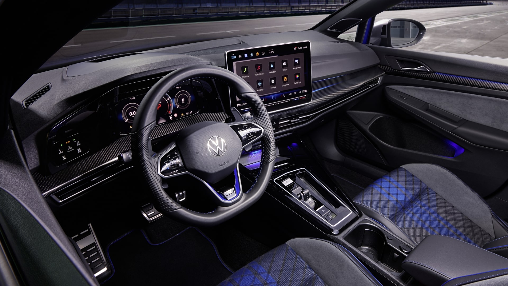  Driver's-side view of the Volkswagen Golf R's interior, showing the steering wheel and dashboard