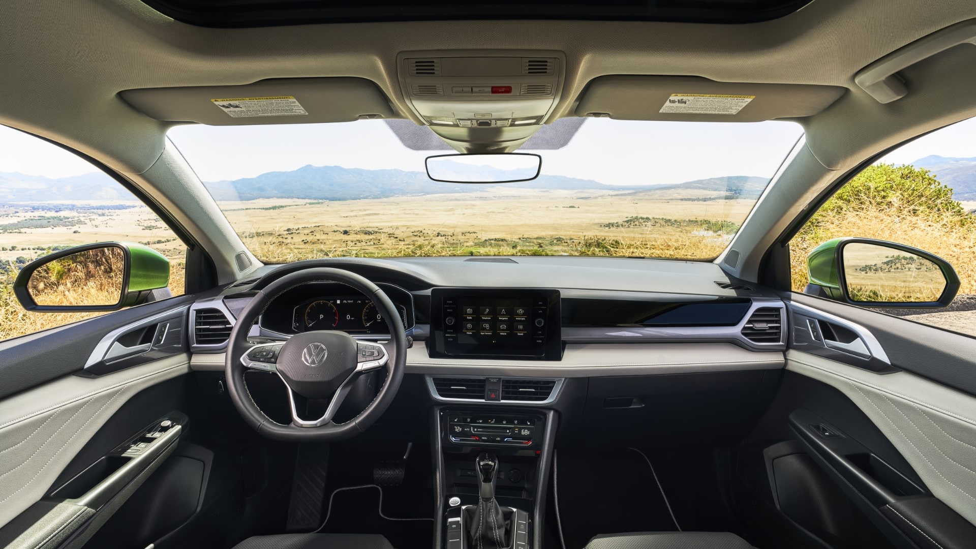 The 2025 Taos interior with a clean, contemporary dashboard, a digital display, and sleek controls.