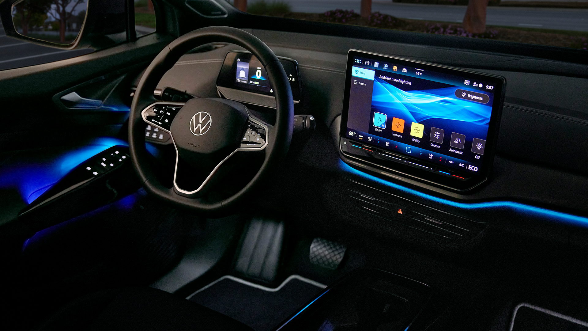 Volkswagen ID.4 interior at night, showing the illuminated dashboard and infotainment screen.